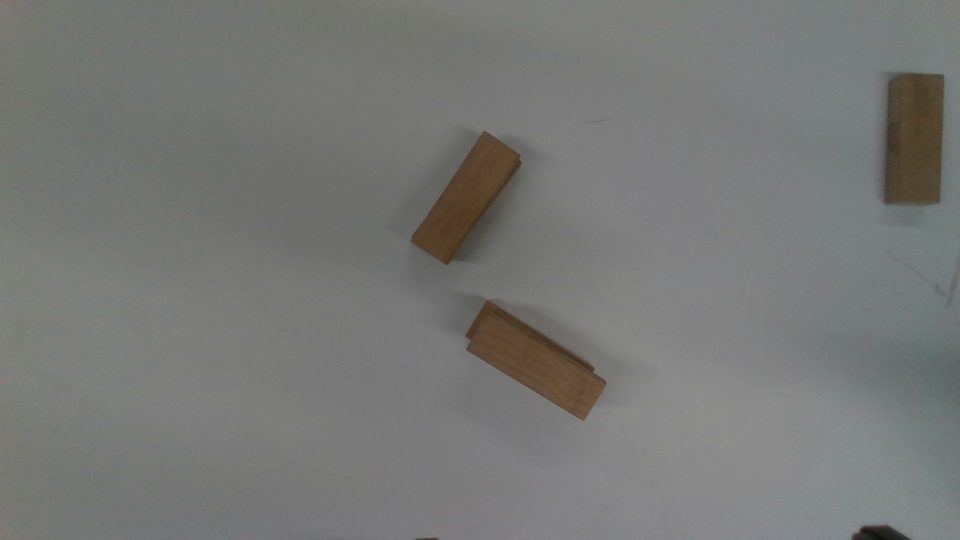 Raw color frame of wooden blocks on a white table